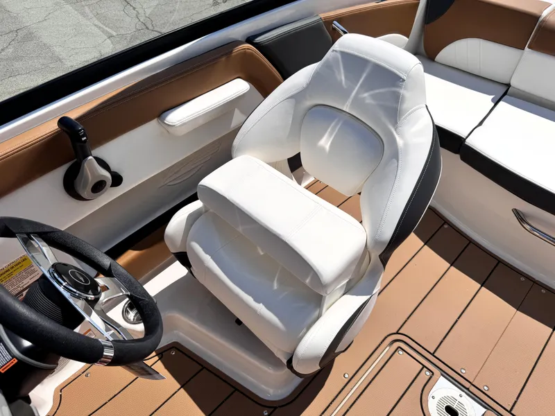 Slide: The Image of 2025 Chaparral 21 SSi OB boat interior with white seating and brown flooring. - 11