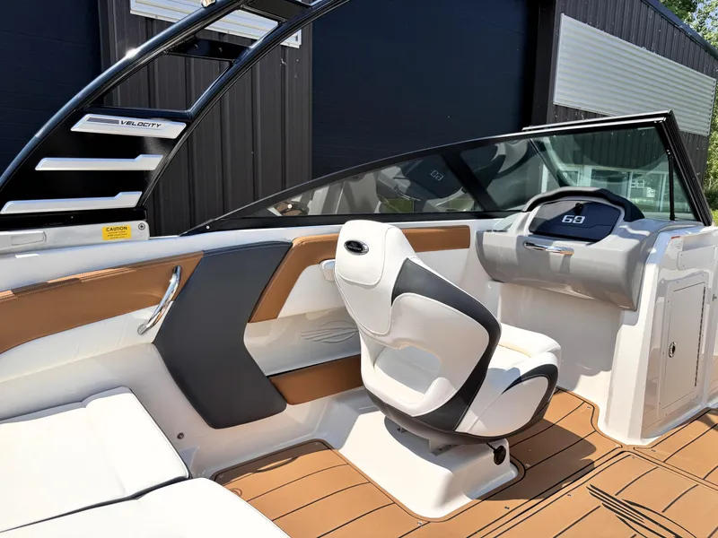 Slide: The Image of 2025 Chaparral 21 SSi OB boat interior with modern helm and seating. - 14