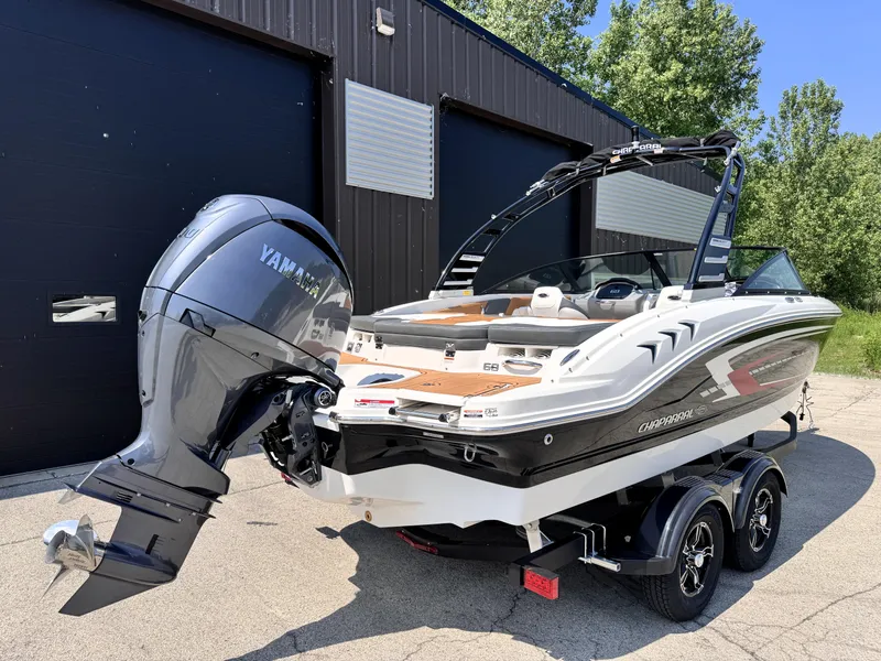 Slide: The Image of 2025 Chaparral 21 SSi OB boat with Yamaha outboard motor on trailer. - 2