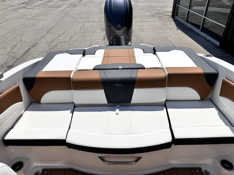 Slide: The Image of 2025 Chaparral 21 SSi OB boat with stylish brown and white seating. - 5