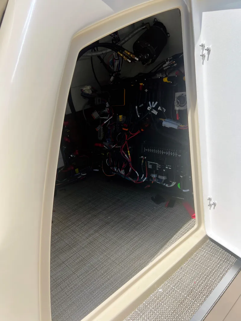 Slide: The Image of 2026 Starcraft RX 23 R DC boat speaker and canopy, sunny outdoor setting. - 18