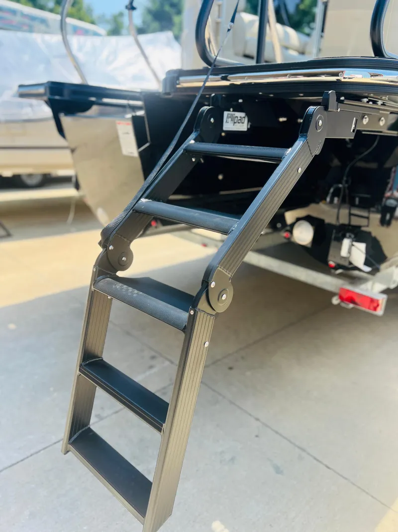 Slide: The Image of 2026 Starcraft RX 23 R DC boat cruising on a calm lake with passengers. - 3