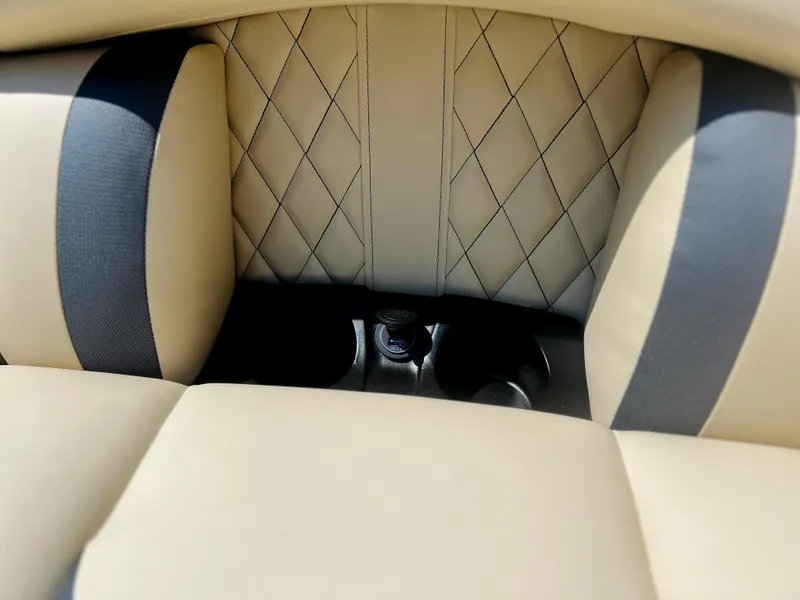 Slide: The Image of Luxurious interior of 2026 Starcraft RX 23 R DC boat with plush seating and modern dashboard. - 7