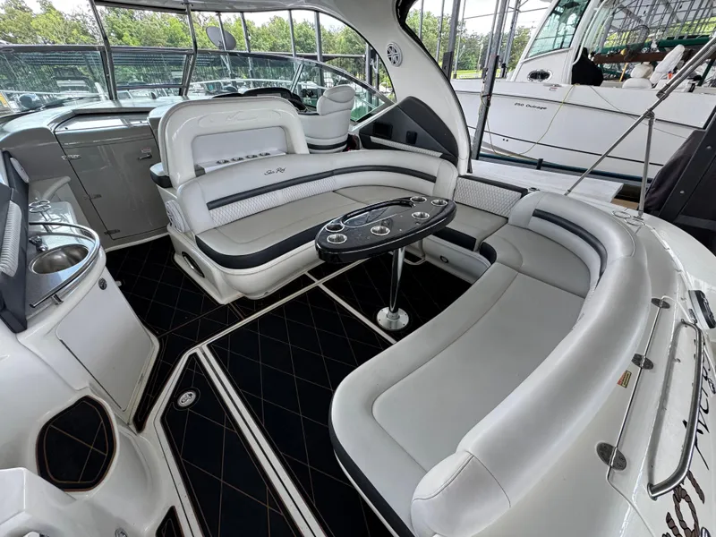Slide: The Image of Luxurious interior of 2005 Sea Ray 420 Sundancer yacht with elegant seating and table. - 24