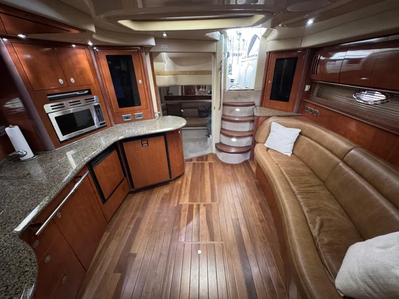Slide: The Image of Luxurious interior of 2005 Sea Ray 420 Sundancer yacht with wood flooring and modern amenities. - 31