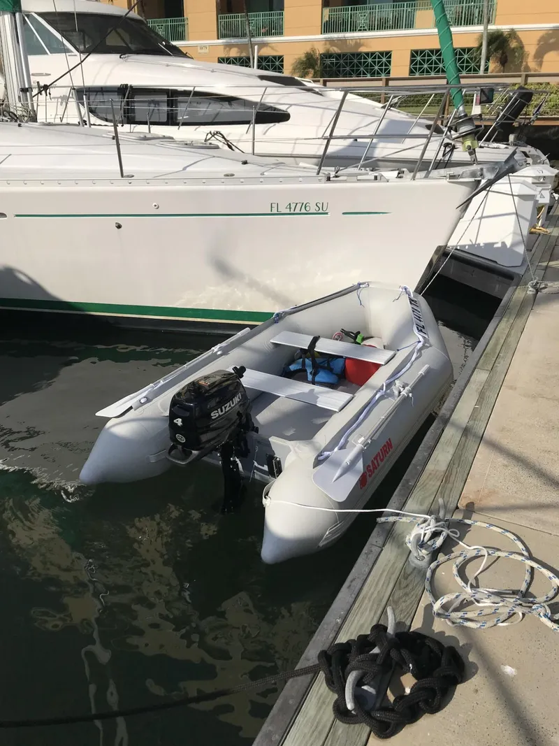 Slide: The Image of Beneteau First 42s7 sailboat docked with inflatable dinghy, 1995 model. - 32