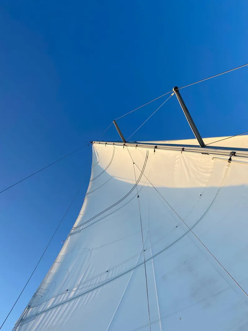 Slide: The Image of Sail of 1995 Beneteau First 42s7 against clear blue sky. - 36