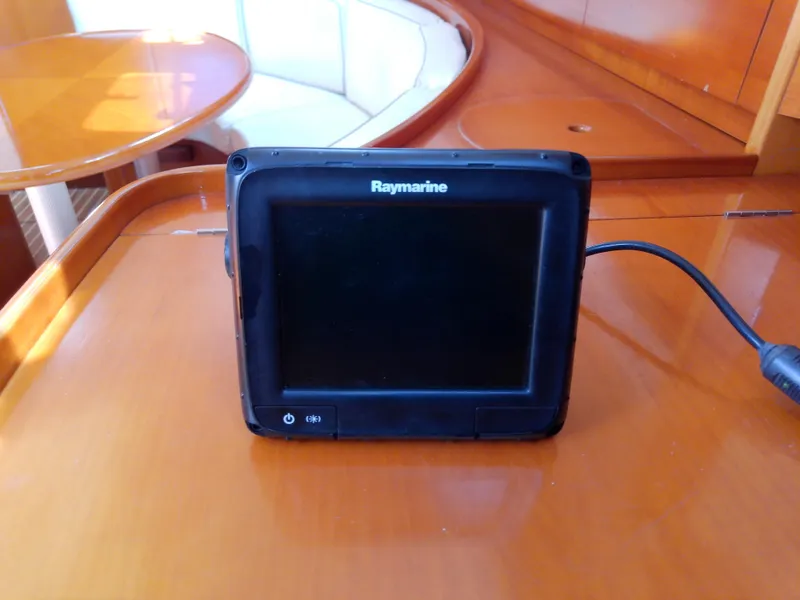 Slide: The Image of Raymarine device on Beneteau First 42s7 yacht's wooden interior, 1995 model. - 44