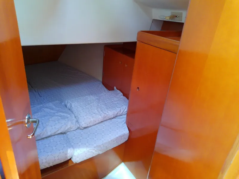 Slide: The Image of Cozy cabin interior of 1995 Beneteau First 42s7 sailboat with wooden finish. - 47