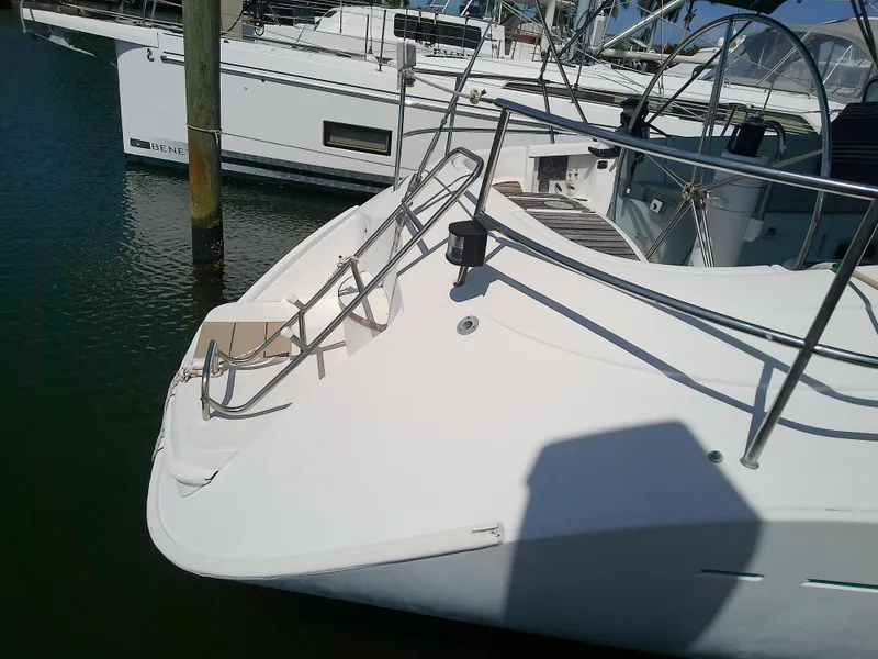 Slide: The Image of Beneteau First 42s7 sailboat, 1995 model, docked in marina, showing deck and railing. - 5