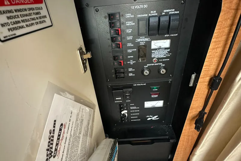 Slide: The Image of Electrical panel inside 2006 Sea Ray 320 Sundancer boat cabin. - 22