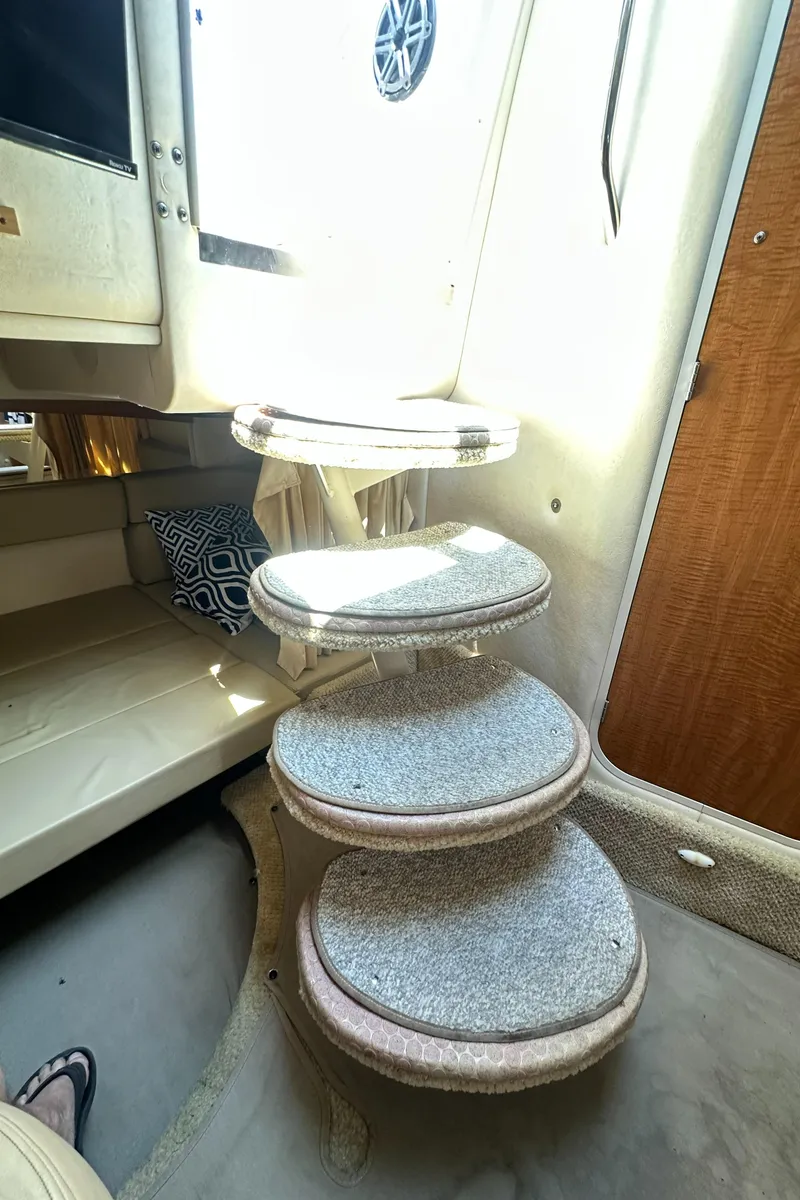 Slide: The Image of Interior steps of 2006 Sea Ray 320 Sundancer yacht, featuring carpeted design and compact layout. - 23