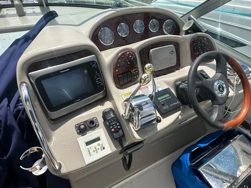 Slide: The Image of Control panel of a 2006 Sea Ray 320 Sundancer boat with navigation equipment. - 3