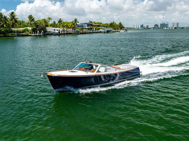 Slide: The Image of 2004 Hinckley Talaria 29 R cruising on a sunny, tropical waterway. - 40