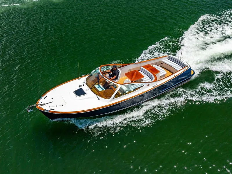 Slide: The Image of 2004 Hinckley Talaria 29 R cruising on open water, showcasing sleek design and luxury. - 41
