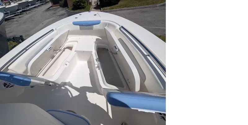 Slide: The Image of 2025 Robalo R202 Explorer boat interior with seating and storage compartments. - 9