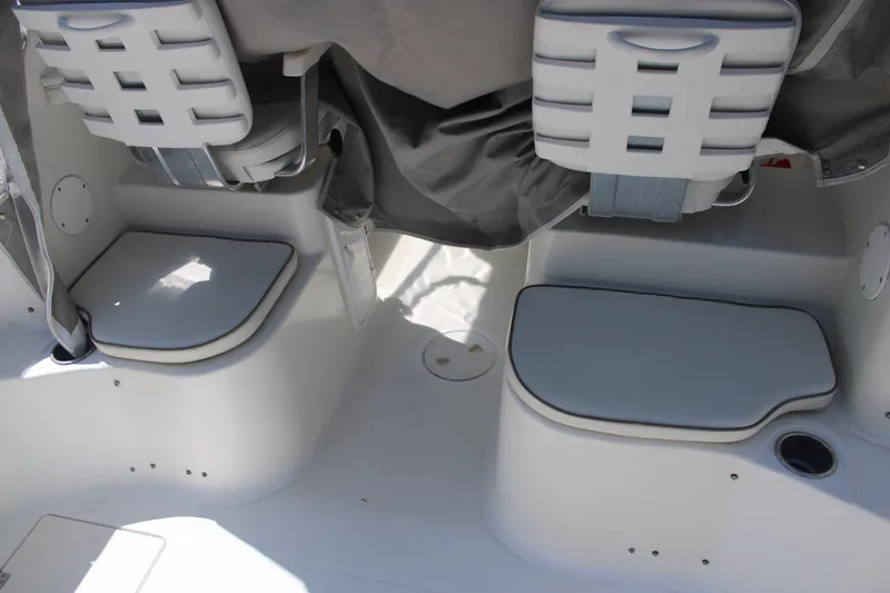 Slide: The Image of 2001 Wellcraft 230 Coastal boat interior seating and storage compartments. - 11