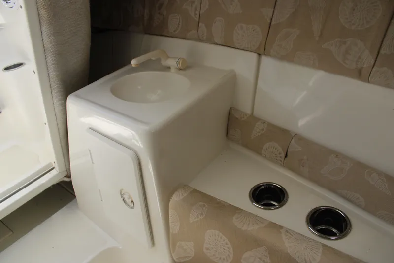 Slide: The Image of Interior of 2001 Wellcraft 230 Coastal boat with sink and cup holders. - 13