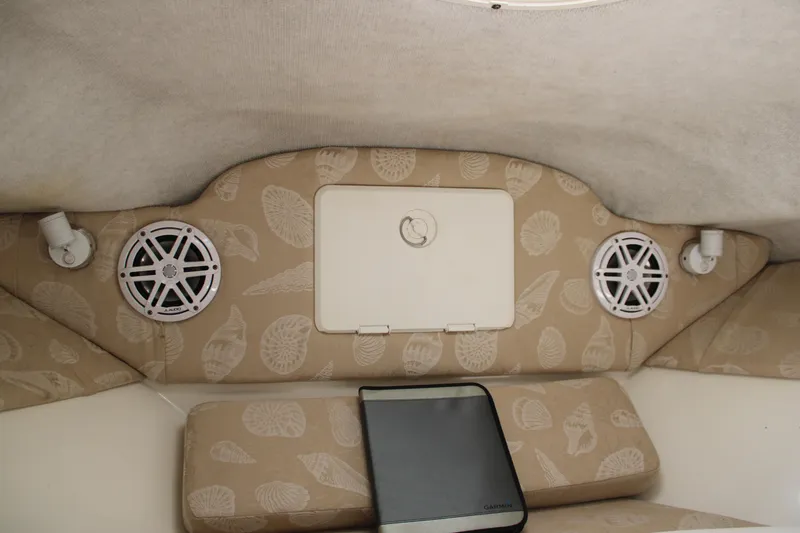Slide: The Image of Interior of 2001 Wellcraft 230 Coastal boat with patterned cushions and speakers. - 15