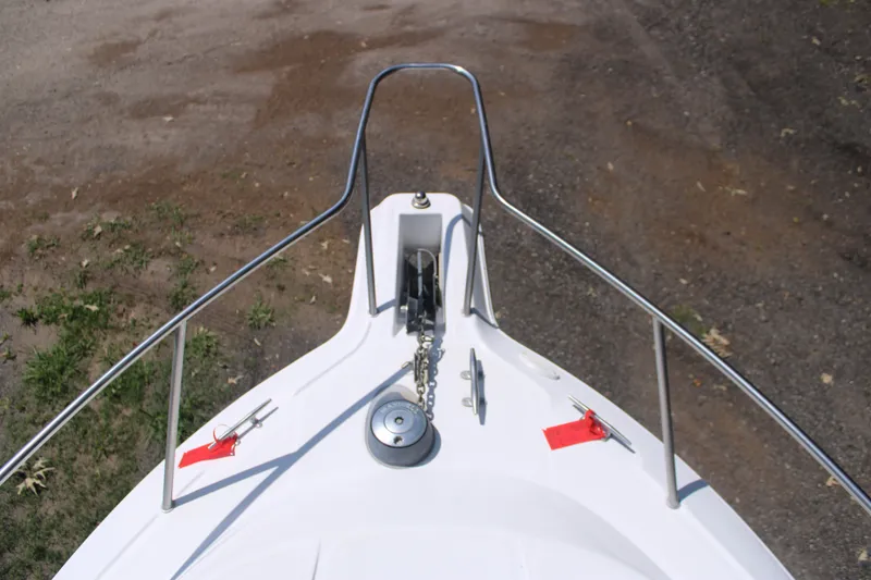Slide: The Image of Bow view of 2001 Wellcraft 230 Coastal boat with anchor chain and railings. - 6