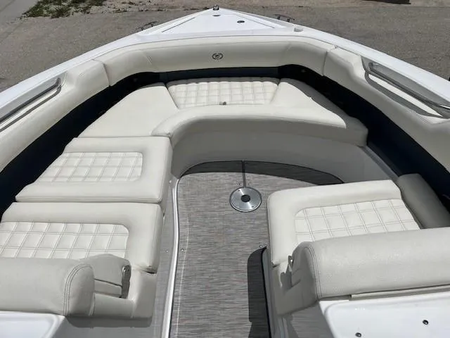 Slide: The Image of 2022 Cobalt 30SC boat with luxurious white seating and spacious deck area. - 4