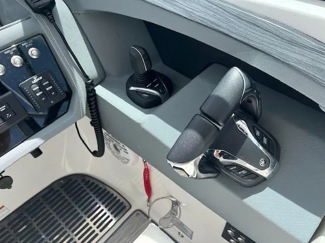 Slide: The Image of Control panel of 2022 Cobalt 30SC boat with throttle and joystick. - 6