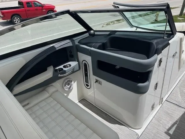 Slide: The Image of 2022 Cobalt 30SC boat interior with seating and dashboard, featuring modern design elements. - 7