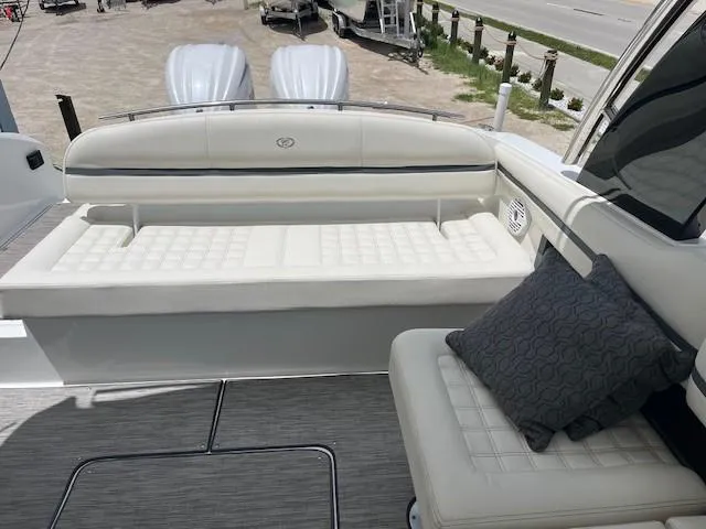 Slide: The Image of Luxury seating on 2022 Cobalt 30SC boat with cushioned seats and pillow. - 8
