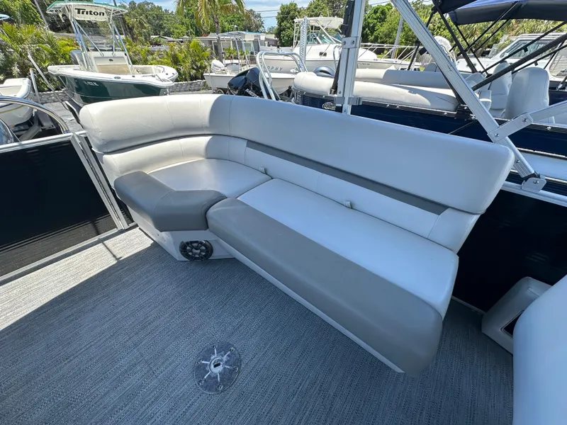 Slide: The Image of 2022 Godfrey Sweetwater 2286 FS boat interior with plush seating and modern design. - 15