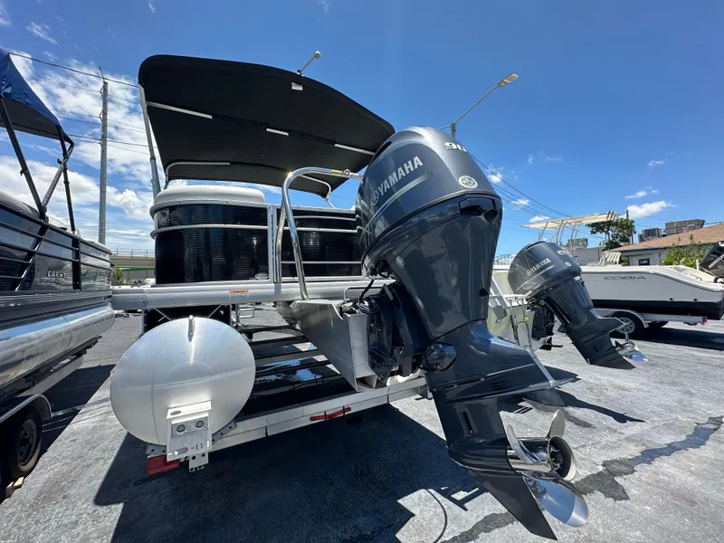 Slide: The Image of 2022 Godfrey Sweetwater 2286 FS pontoon boat with Yamaha outboard motor on trailer. - 4