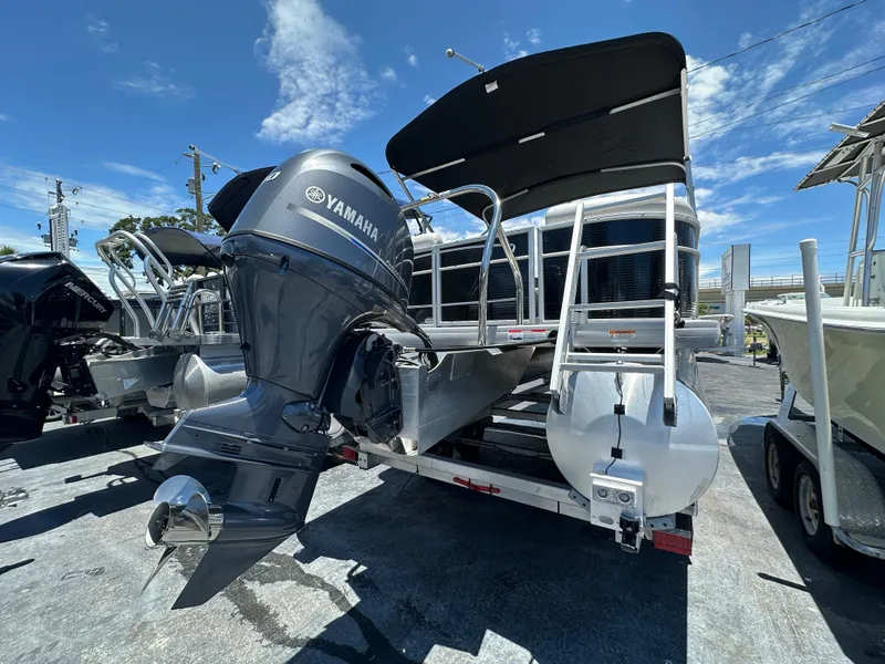 Slide: The Image of 2022 Godfrey Sweetwater 2286 FS pontoon boat with Yamaha engine, parked outdoors. - 6