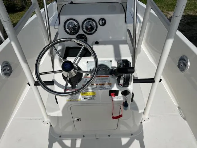Slide: The Image of 2024 Bayliner Trophy T18Bay boat console with steering wheel and gauges. - 5