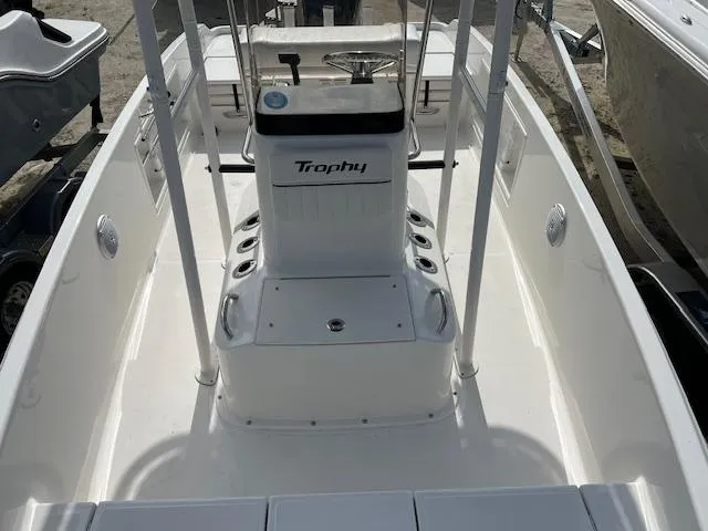 Slide: The Image of 2024 Bayliner Trophy T18Bay boat interior with center console and seating. - 9