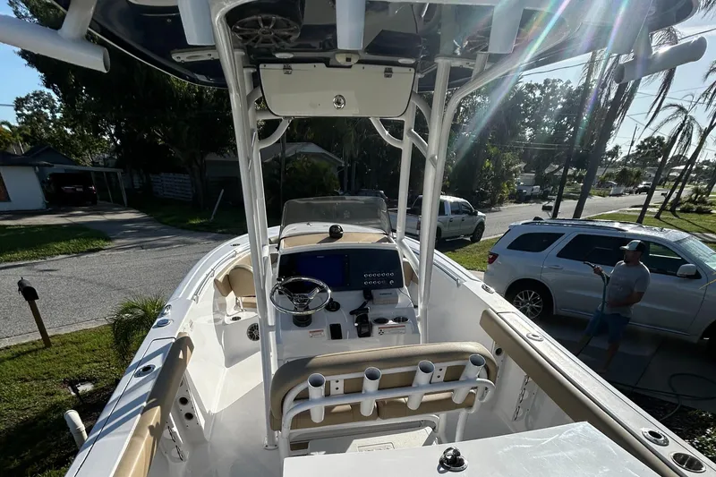 Slide: The Image of 2017 Sportsman Heritage 231 Center Console boat, parked in a residential area. - 13