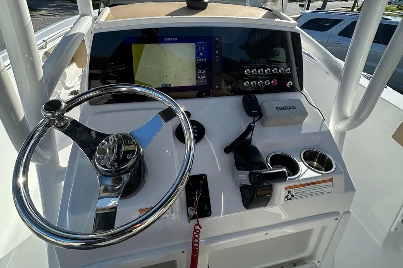 Slide: The Image of 2017 Sportsman Heritage 231 Center Console dashboard with steering wheel and navigation display. - 18
