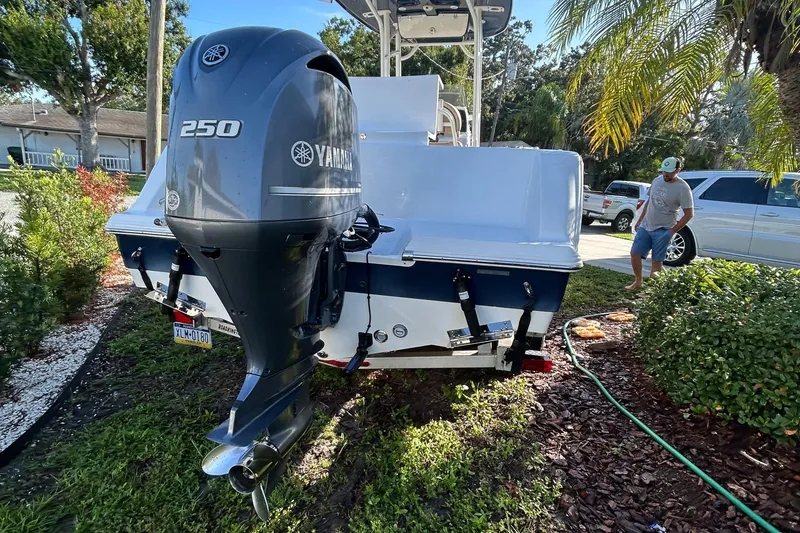 Slide: The Image of 2017 Sportsman Heritage 231 Center Console with Yamaha 250 engine, parked outdoors. - 2