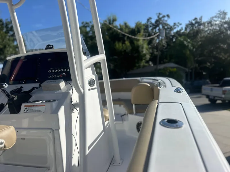 Slide: The Image of 2017 Sportsman Heritage 231 Center Console boat, featuring sleek design and modern controls. - 4