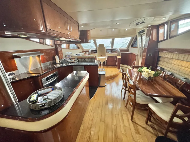 Slide: The Image of Luxurious interior of a 2006 Marquis 65 yacht with elegant wood finishes. - 20