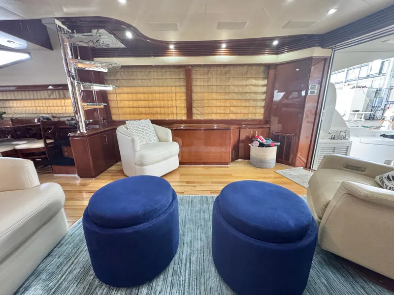 Slide: The Image of Luxurious interior of a 2006 Marquis 65 yacht with plush seating and elegant decor. - 23