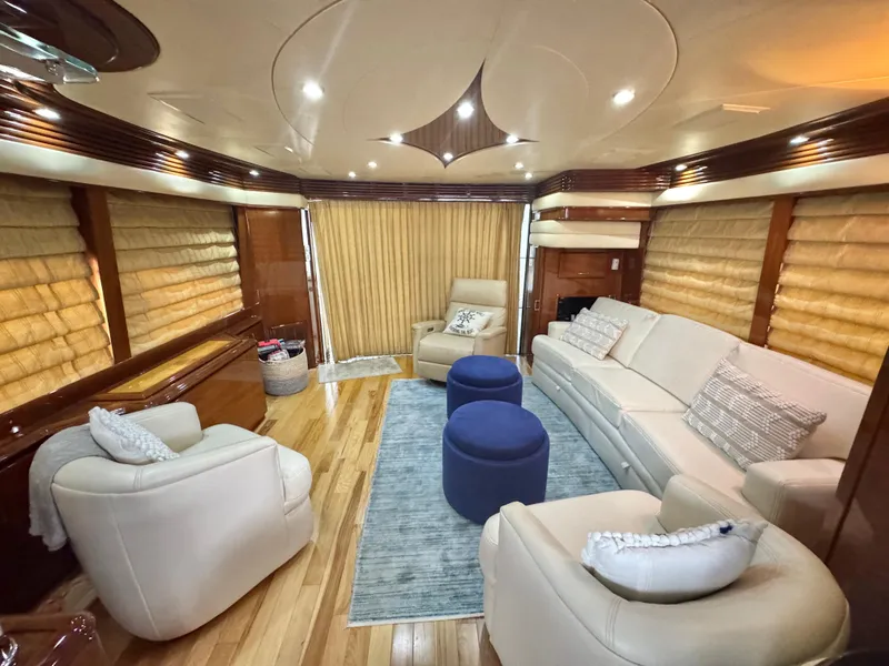 Slide: The Image of Luxurious interior of a 2006 Marquis 65 yacht with elegant seating and modern decor. - 24