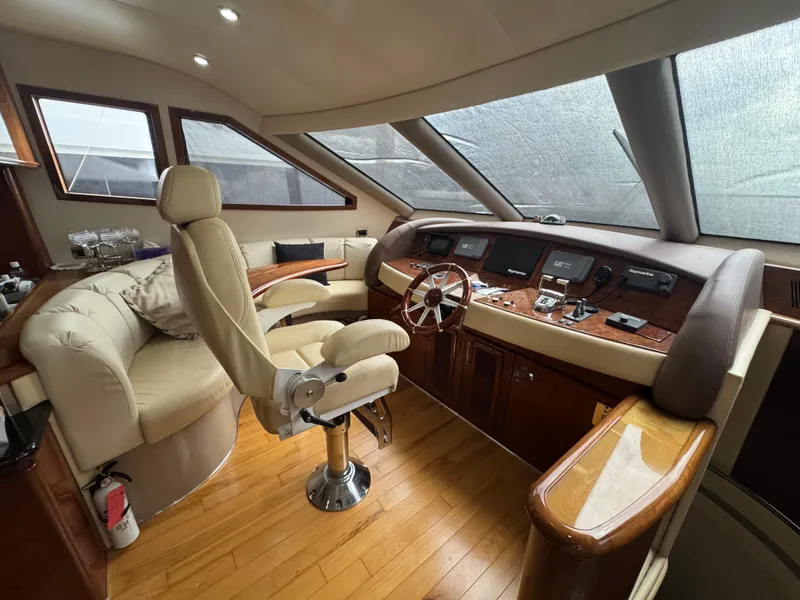 Slide: The Image of Luxurious 2006 Marquis 65 yacht interior with elegant helm and seating area. - 30