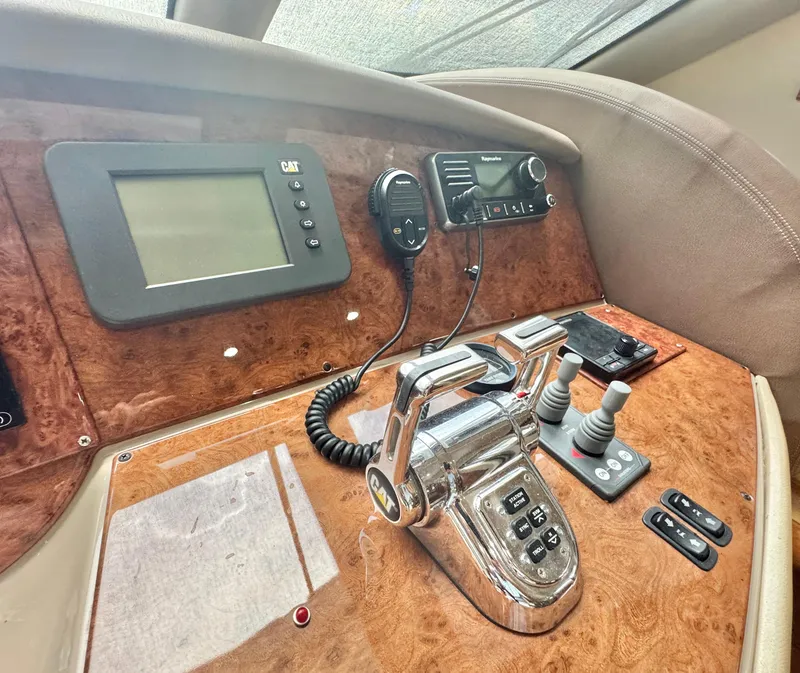 Slide: The Image of Control panel of a 2006 Marquis 65 yacht with navigation and communication equipment. - 34
