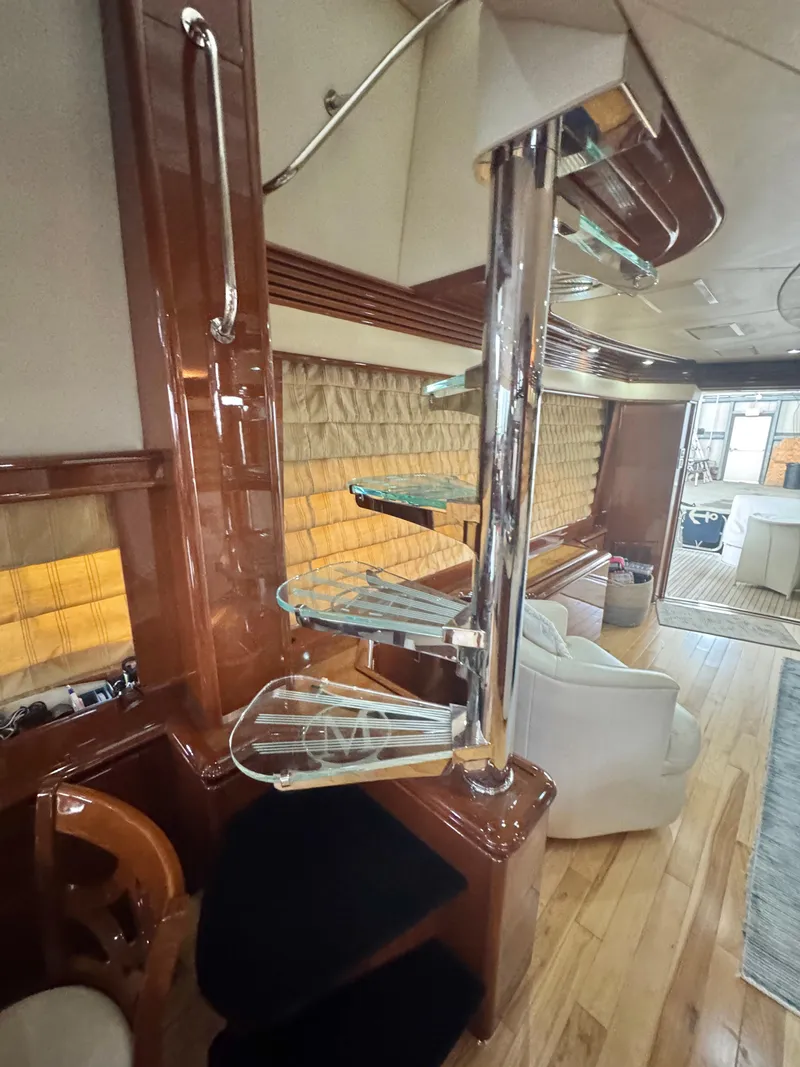 Slide: The Image of Luxurious interior of a 2006 Marquis 65 yacht with modern spiral staircase. - 35