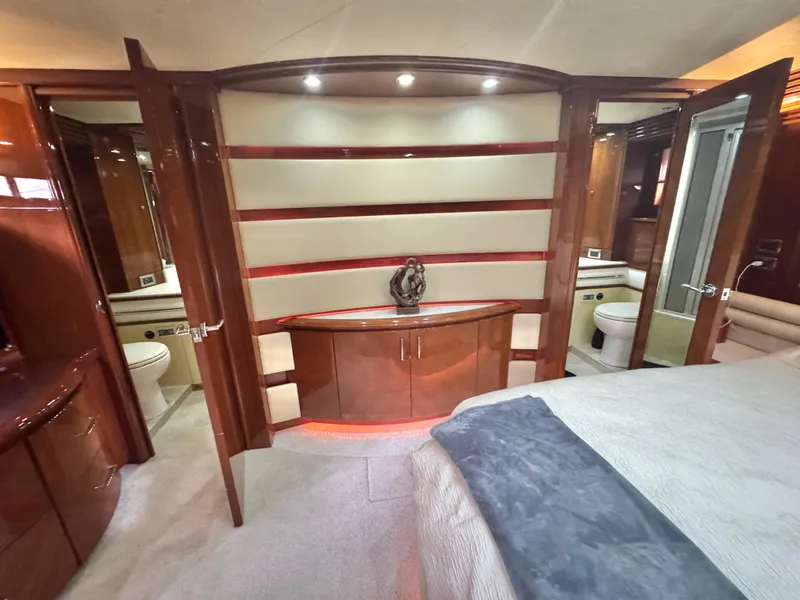 Slide: The Image of Luxurious interior of a 2006 Marquis 65 yacht featuring elegant wood cabinetry and modern design. - 41