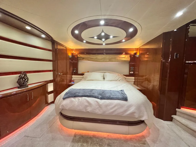 Slide: The Image of Luxurious bedroom interior of a 2006 Marquis 65 yacht with modern lighting and elegant decor. - 42