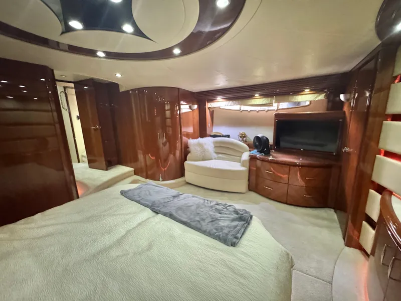 Slide: The Image of Luxurious interior of a 2006 Marquis 65 yacht with elegant wood finishes and cozy seating. - 43