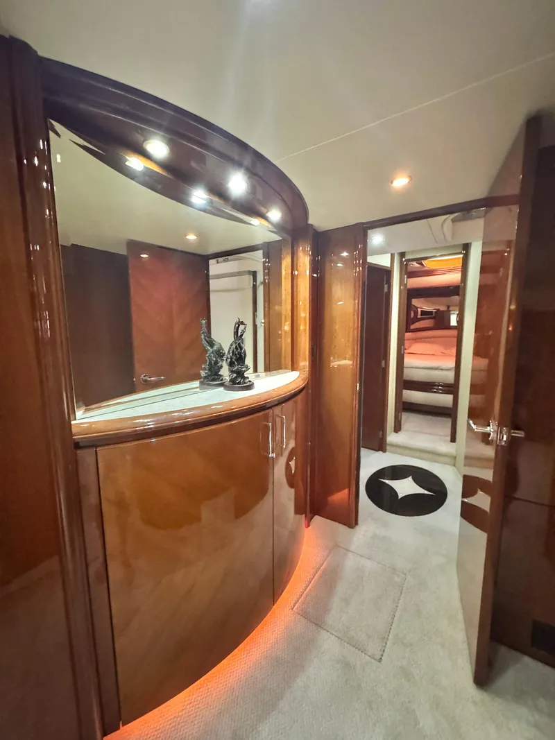 Slide: The Image of Luxurious interior of a 2006 Marquis 65 yacht with elegant wood finishes and ambient lighting. - 44