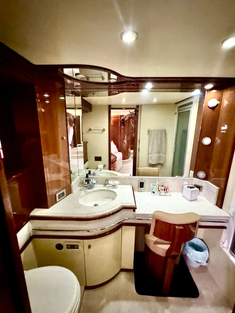 Slide: The Image of Luxurious bathroom in a 2006 Marquis 65 yacht with elegant wood accents. - 46