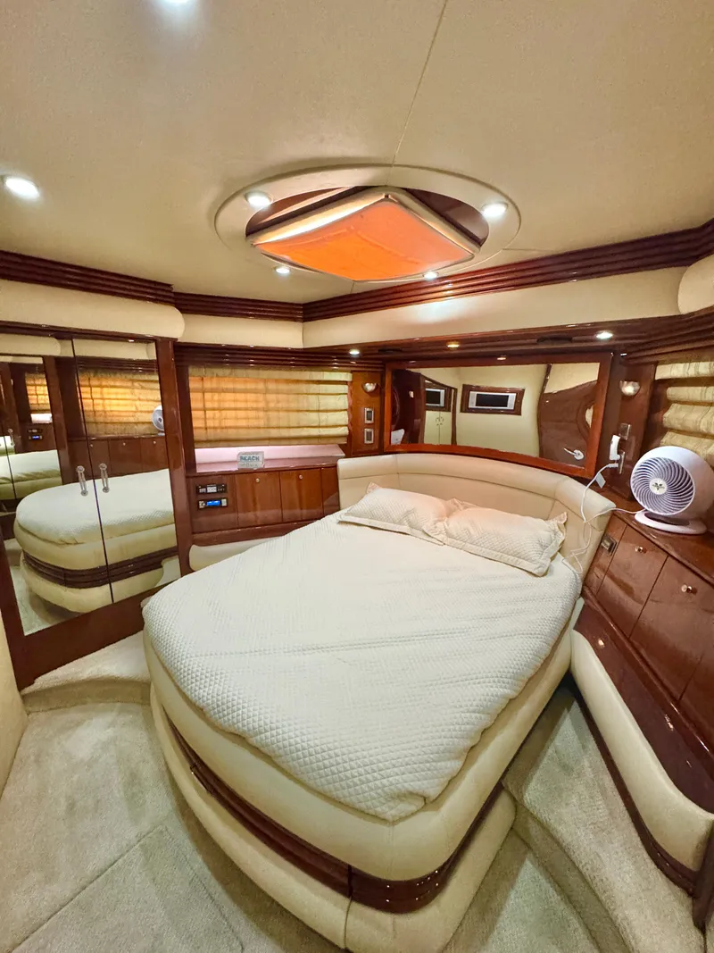 Slide: The Image of Luxurious interior of a 2006 Marquis 65 yacht with elegant wood finishes. - 49