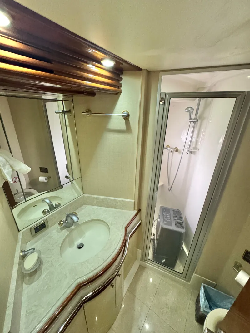 Slide: The Image of Luxurious bathroom in 2006 Marquis 65 yacht with modern fixtures and shower. - 54